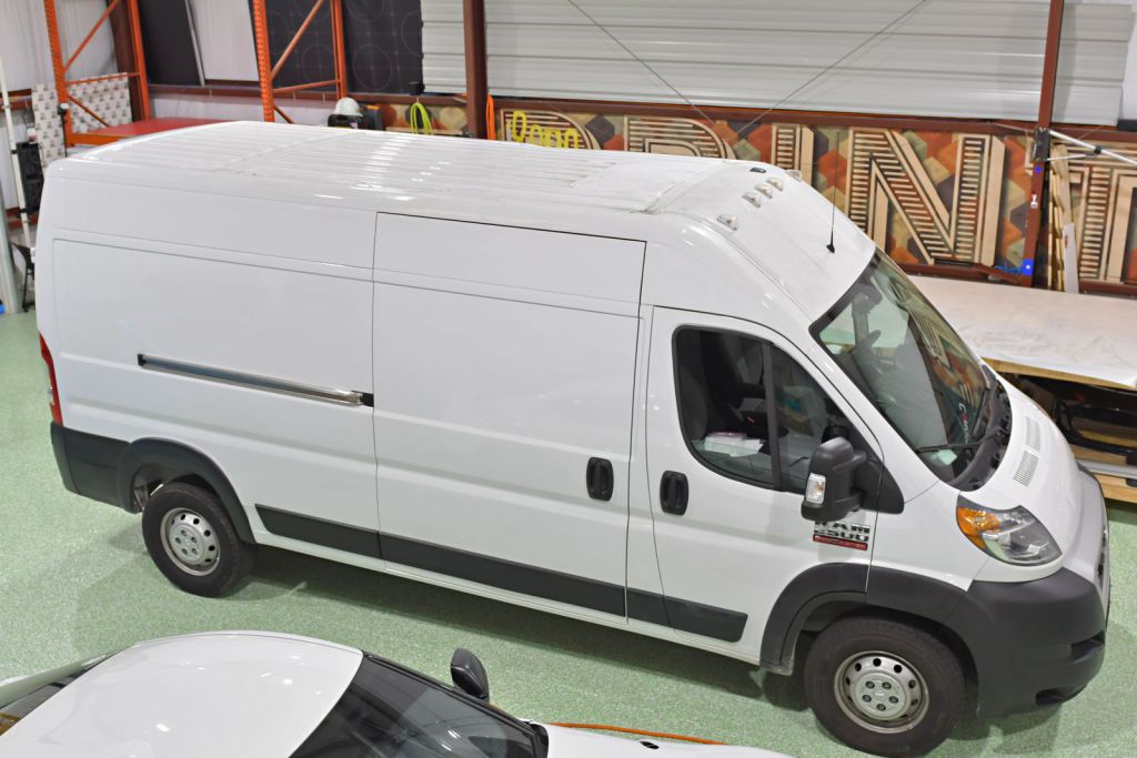 White Ram 1500 Van Wrap in an installation bay