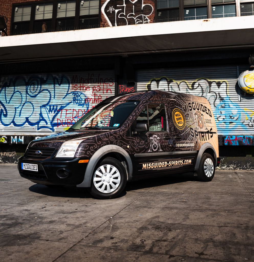 Van wrap in New York City with graffiti in background 