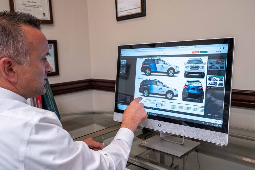 Mobility Prosthetics' Brian Greer Reviewing Wrapmate Subaru car wrap