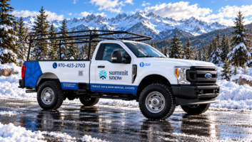 Wrapped work truck in a snowy alpine setting